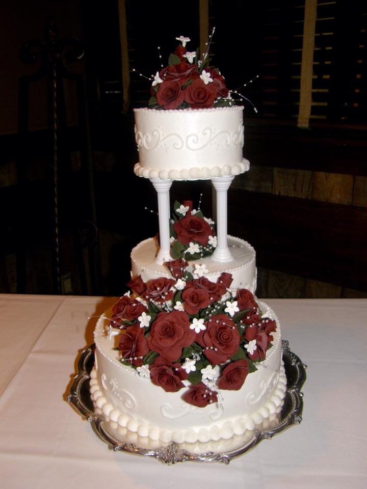three tier wedding cake with red roses