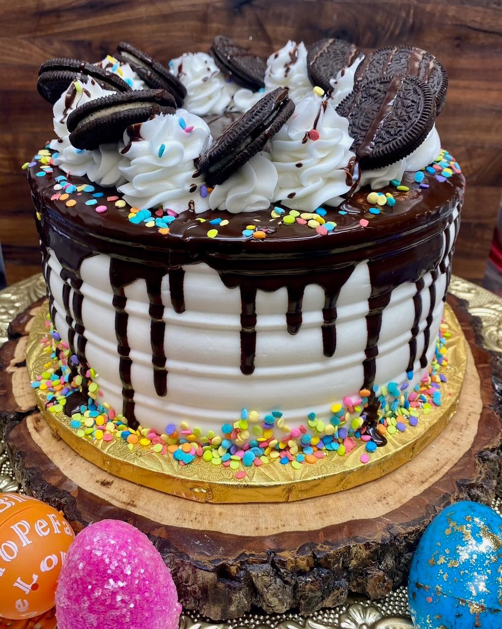white cake with oreos and rainbow sprinkles