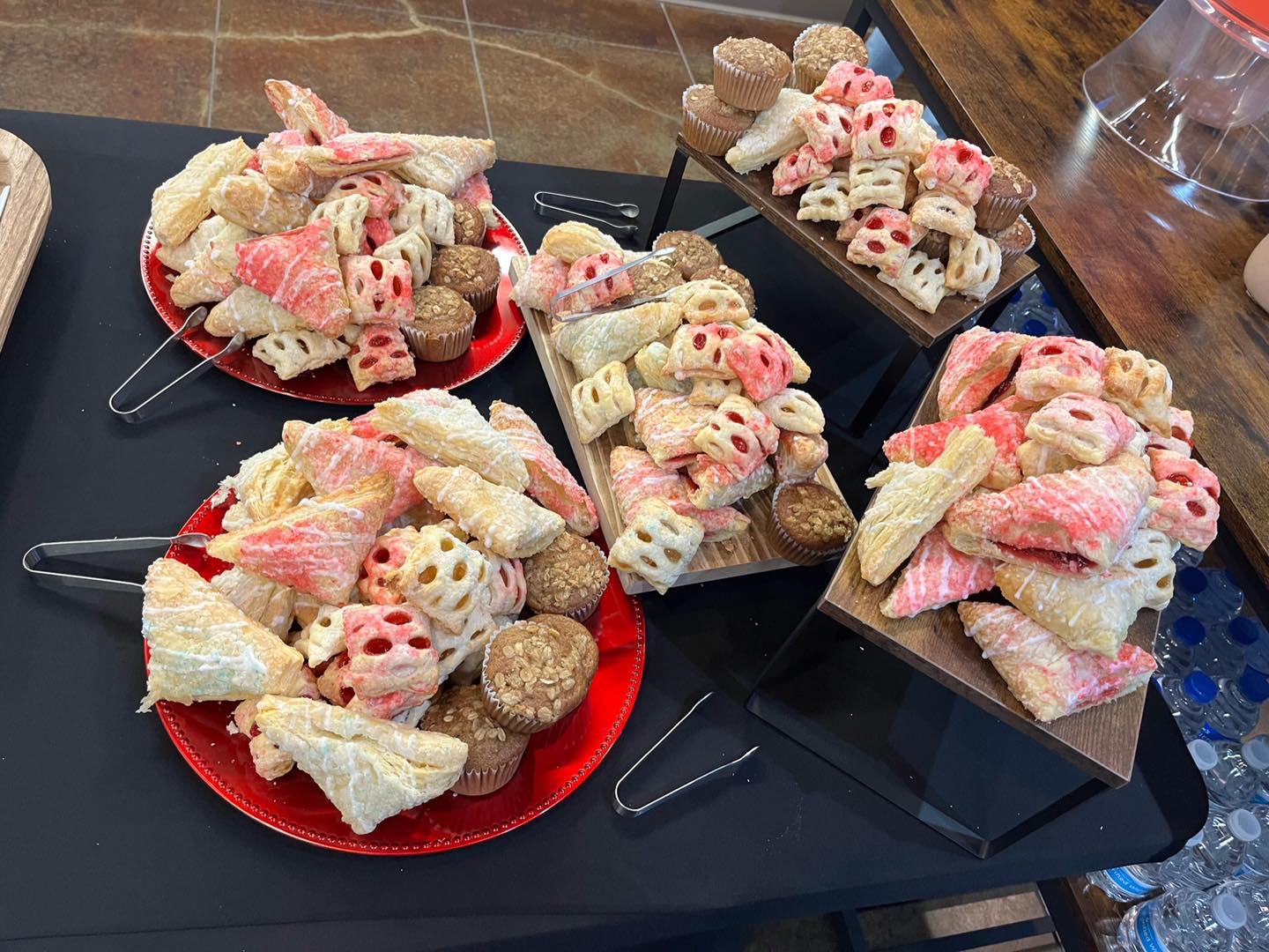 assorted breakfast pastries on serving trays